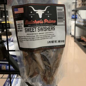 Bag of Sweet Swishers cigarillos on store shelf.